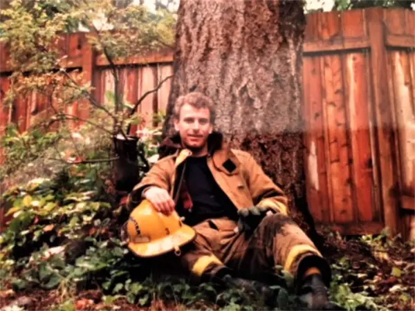 Firefighter by tree
